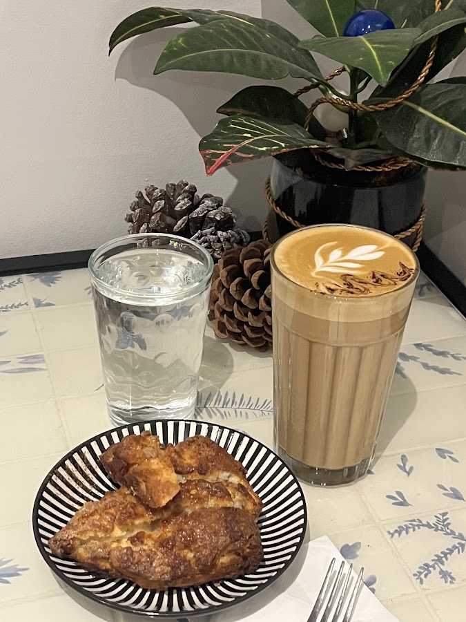 Latte with Chana Masala puff pastry and water at Moments