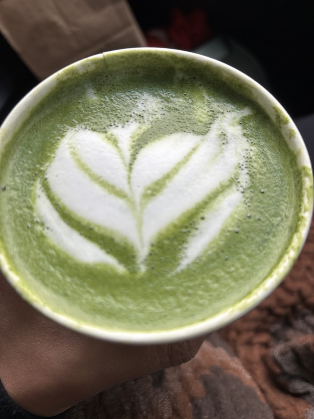 Close-up matcha latte with latte art