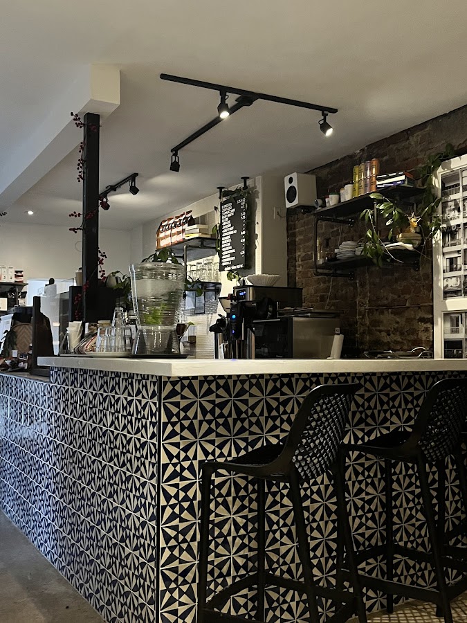 Moments cafe counter with signature patterned tiles and espresso equipment