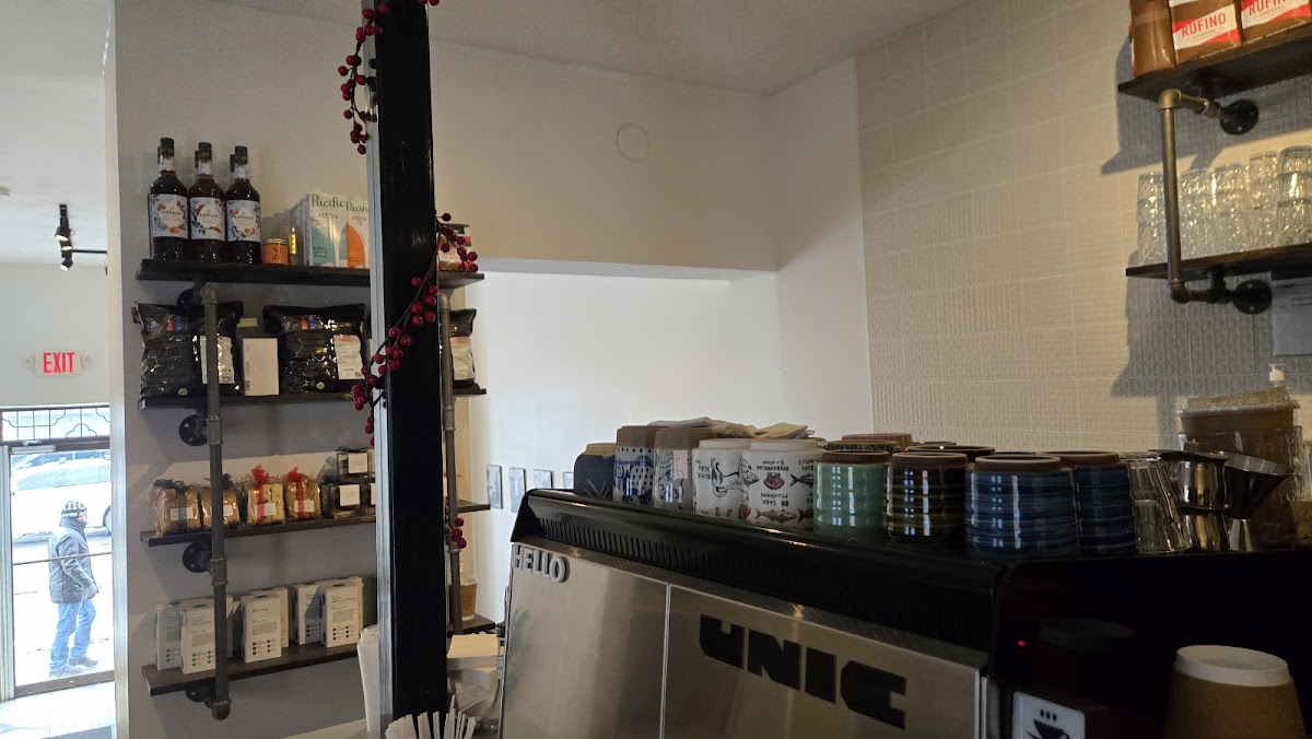 Cafe counter with espresso machine and retail products