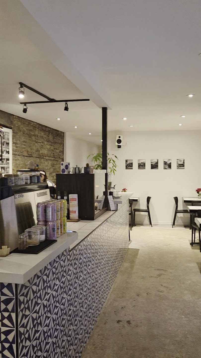 Cafe counter and seating area with signature tiled bar